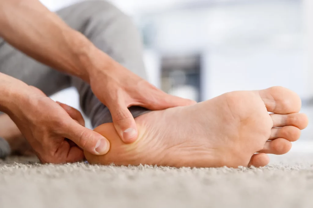 man hands giving foot massage to yourself after a 2021 09 02 11 03 15 utc