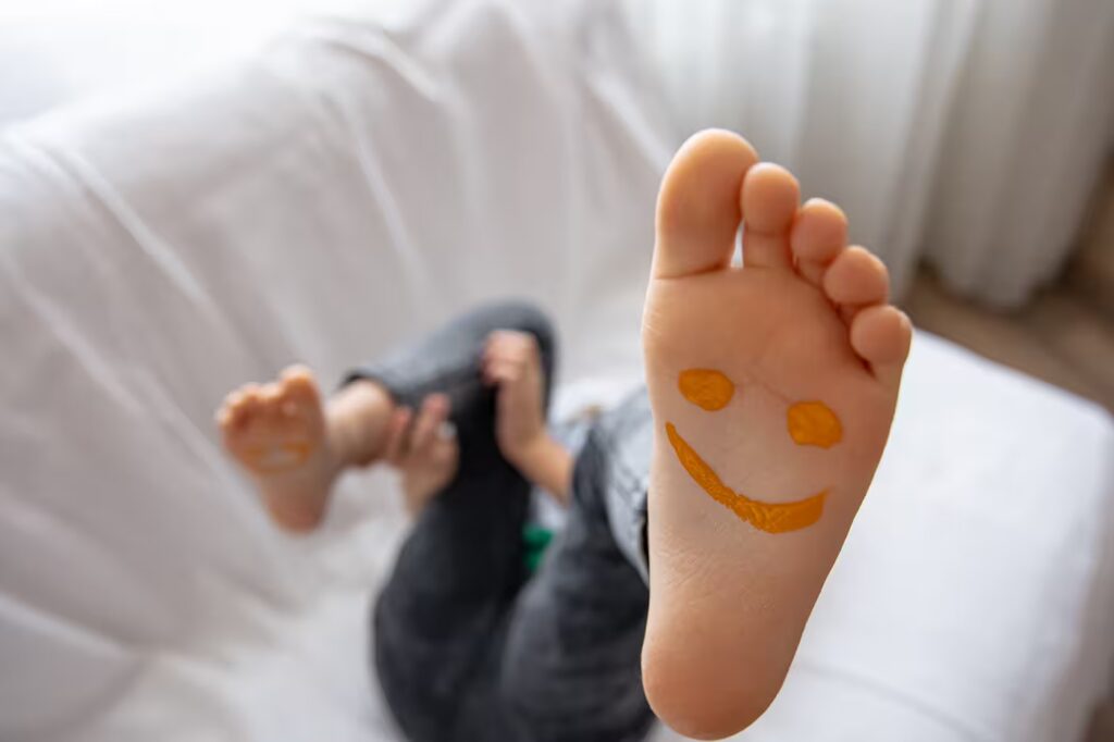 close up of little girl s feet painted with smiles 2025 03 14 10 18 56 utc converted