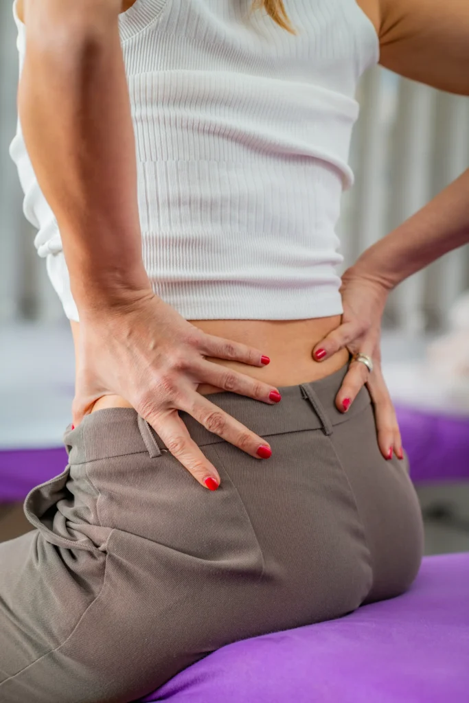 Lower Back Pain 1 woman experiencing lower back pain holding or mas 2025 04 28 21 15 57 utc